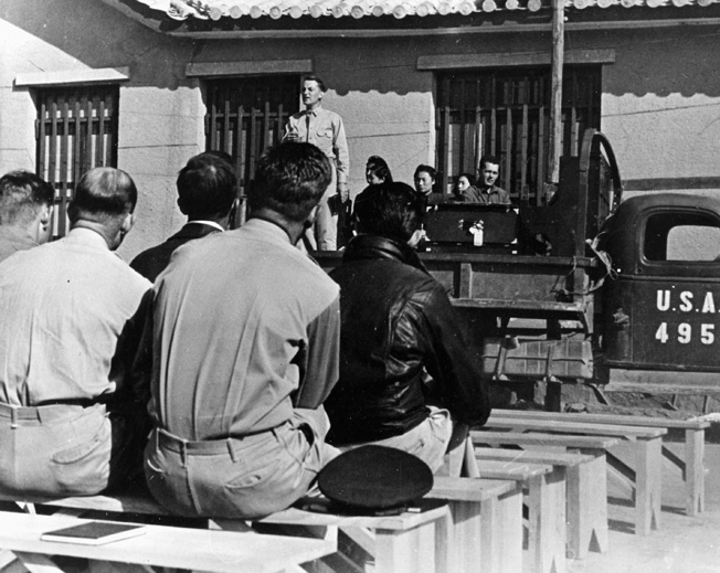 Men of the U.S> Fourteenth Air Force attend Sunday church services at their base in China.