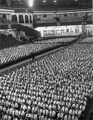 At the Berlin Sports Palace, Nazi Youth Leader Baldur von Schirach addresses a gathering of 12,000 members of the city’s Hitler Youth and BDM. After the war, Schirach was prosecuted at Nuremberg and went to prison for war crimes. 