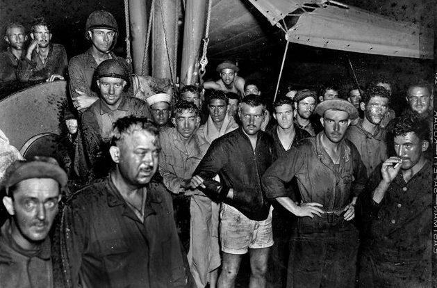 Aboard the minesweeper YMS-241, men of the 1st Fighter Control Company appear relieved. Several U.S. Navy vessels, as well as aircraft, participated in the rescue of the survivors of the SS Cape San Juan, torpedoed by a Japanese submarine on November 11, 1943.