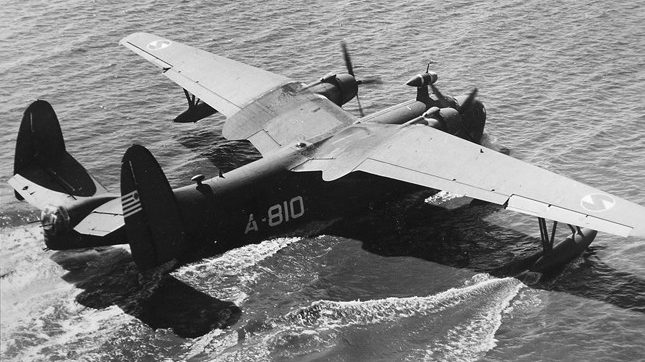 A U.S. Navy Martin PBM Mariner flying boat lands in calm Pacific waters. During the daring rescue of the SS Cape San Juan survivors, conditions were much different. The plane was eventually loaded with 55 passengers, including 48 men plucked from the water.