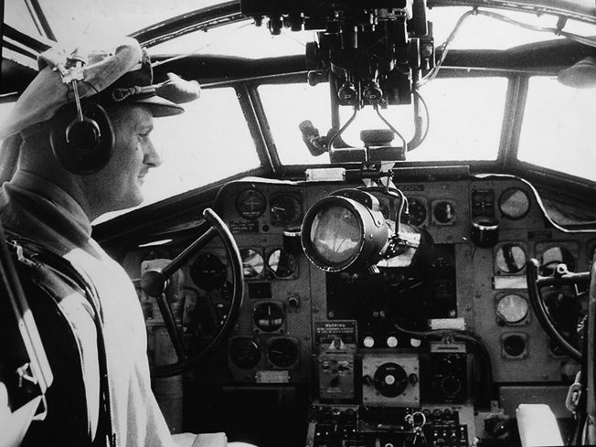 The pilot of a Martin Mariner flying boat sits in the cockpit of the aircraft. The crewmen that rescued survivors of the SS Cape San Juan put their lives on the line during the event.