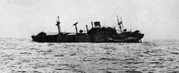 Photographed the day after it was attacked by the Japanese submarine I-21, the troopship SS Cape San Juan lists sharply to port. Soon after this photo was taken, the ship slipped beneath the waves.