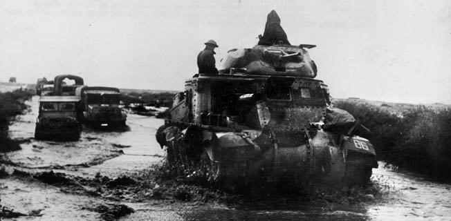 This American-built Grant tank, supplied to the British through Lend-Lease, slows during a desert rain as British forces pursue the Germans after El Alamein. Two days of heavy rain prevented the British from cutting off Rommel’s remaining troops as they retreated.