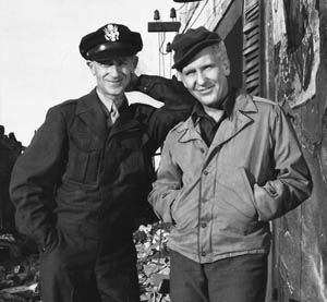 Pyle (left) stands with Burgess Meredith.