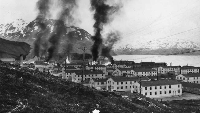 Buildings burn at Fort Mears following the June 3rd hit-and-run attack on Dutch Harbor. Twenty-five defenders were killed during the 20-minute attack. 