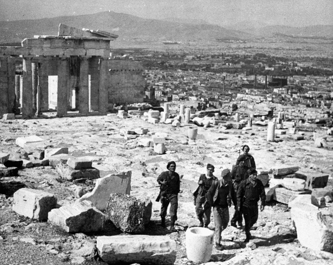 British troops who have recently taken part in the liberation of Athens take in the sights of the Acropolis. The British troops were also involved in combat with Communist ELAS guerrillas in the city