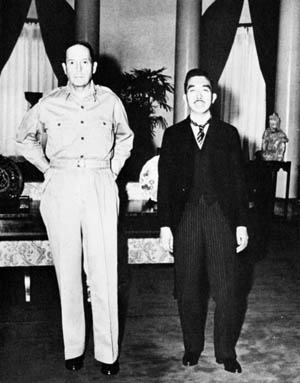 Following their first meeting, General Douglas MacArthur (left) and Emperor Hirohito pause for photographers on October 10, 1946.