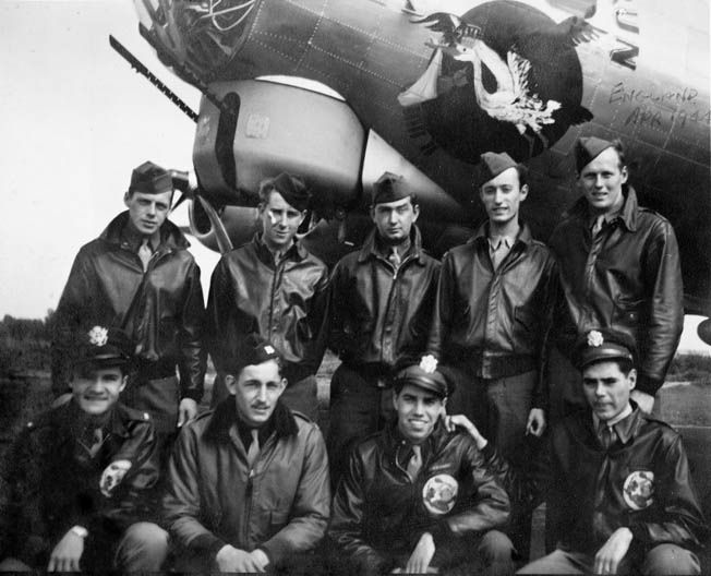 The crew of the Boeing B-17 Flying Fortress bomber Jeannie Marie that participated in the raid on Oschers- leben, Germany, on February 22, 1944, posed for this photograph in front of another crew’s plane. They included, left to right standing, Sergeant Rudy Malkin, Sergeant Elmer Diethorn, Sergeant Ward Simonson, Sergeant Gordon Wiggett, and Sergeant Philip Lunt. Kneeling in front are Lieutenant Bob Roberts, Captain Lester Rentmeester, Lieutenant Bill Behrend, and Lieutenant Joe Ashby. Sergeant Frank Topits, the ball-turret gunner, was in the hospital when the photo was taken.