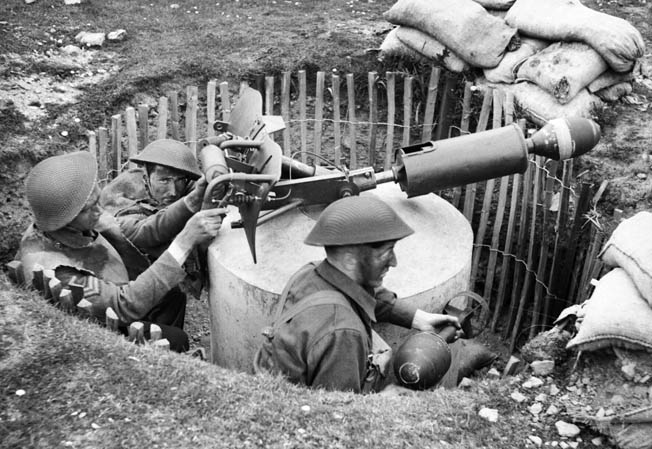 In this May 1943 photograph, a trio of Home Guardsmen train with a Blacker Bombard spigot mortar. Although supplies and weapons were limited in the early months of the Home Guard’s activities, they were better armed as World War II progressed.