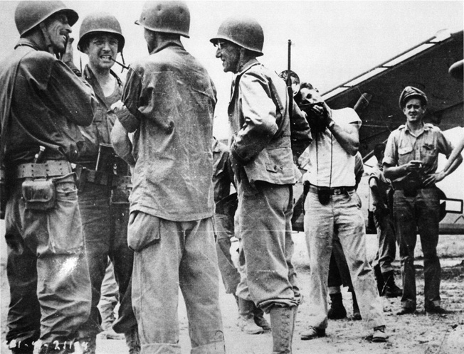 General Joseph Stilwell, commander of American troops in the China-Burma-India Theater, confers with Brigadier General Frank Merrill of Merrill’s Marauders fame and Colonel Charles Hunter at an airfield near Myitkyina.