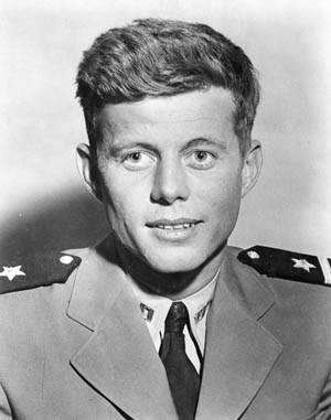 A youthful John F. Kennedy poses for a photographer while wearing the uniform a U.S. Navy lieutenant. Kennedy nearly lost his life before he ever took command of the PT-109.