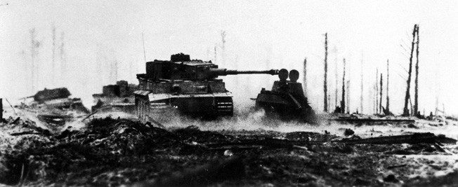 Silhouetted against a battle-scarred landscape, a German Tiger tank is seen in action at Kursk on July 13, 1943.