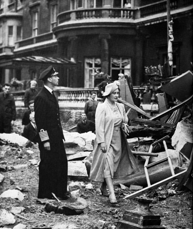 Following the German air raid of September 11, 1940, King George VI and Queen Elizabeth inspect the damage to Buckingham Palace.
