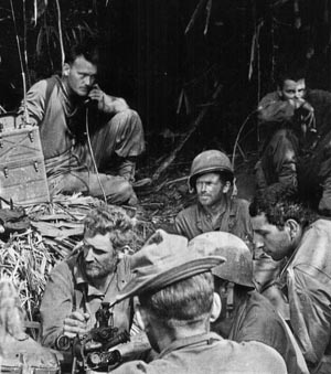 Tension is written on the faces of these Marauders as they wait to attack Japanese positions, March 1944.