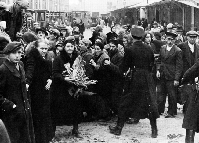 SS troops round up Polish Jews the day after Poland surrenders.