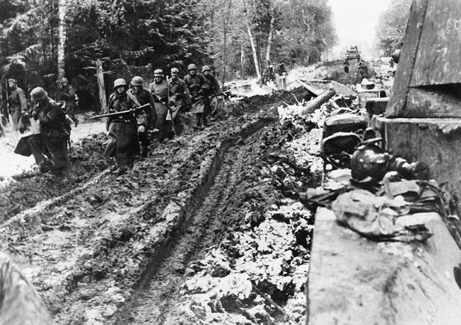 During the autumn of 1941, German SS troops slog along a muddy road near Moscow. Resolute Red Army defenders and harsh weather combined to doom the German effort to capture the Soviet capital city.