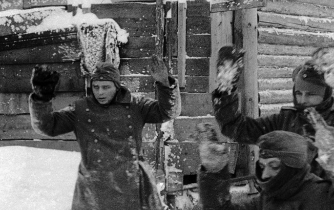 With their hands up, German soldiers capitulate to Soviet troops. Many of those Germans who surrendered during the fighting on the Eastern Front died in captivity. Others were held for years after the end of the war.