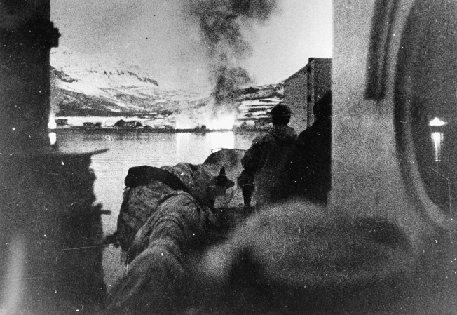 Explosions rock the shores of Bjervik during shelling by the Royal Navy. The bombardment was a prelude to the landing of Allied troops who would battle the invading Germans.