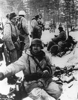 Pausing briefly during their retreat from the Red Army, exhausted soldiers of the German 18th Army may appear to be demoralized. However, plenty of fight remained in these veteran troops.