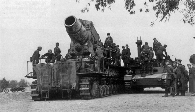 German crewmen service the mammoth 600mm mortar nicknamed “Karl” in preparation for Operation Nordlicht. The Germans relocated several large siege guns from the Crimea to the Leningrad front in an effort to capture the city.