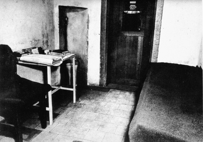 This photograph of a typical cell at the Palace of Justice reveals the spartan accommodations and the lack of personal privacy afforded the prisoners, particularly after the suicide of Robert Ley. 
