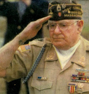 In a modern photograph, Michael Prestianni salutes the colors during a veterans program. The memories of his days at Nuremberg are still vivid in Prestianni's mind more than six decades after the trials.