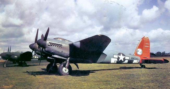 Sporting American markings, de Havilland Mosquito PR XVI of the 654th Bomb Squadron, 25th Bombardment Group sits near the runway at RAG Watton, England.