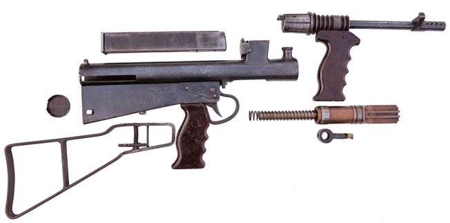 The view of the Owen gun above reveals the relatively few major parts that were fabricated to complete the assembly of the automatic weapon.