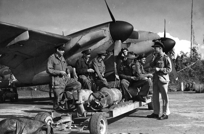 Ground crewmen load bombs onto a Mosquito in Burma. Constructed largely of wood, the de Havilland Mosquito was a fast, maneuverable aircraft that excelled in multiple roles.