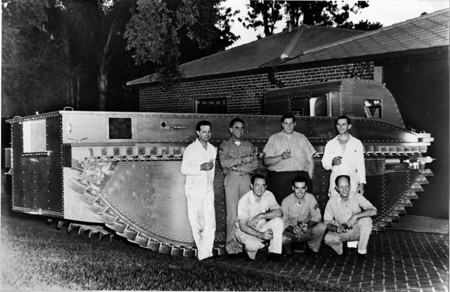 Photographed in the driveway of Donald Roebling’s Florida estate, Roebling and his co-workers pose with the fourth generation amphibious vehicle that became the famed Amtrac during World War II.