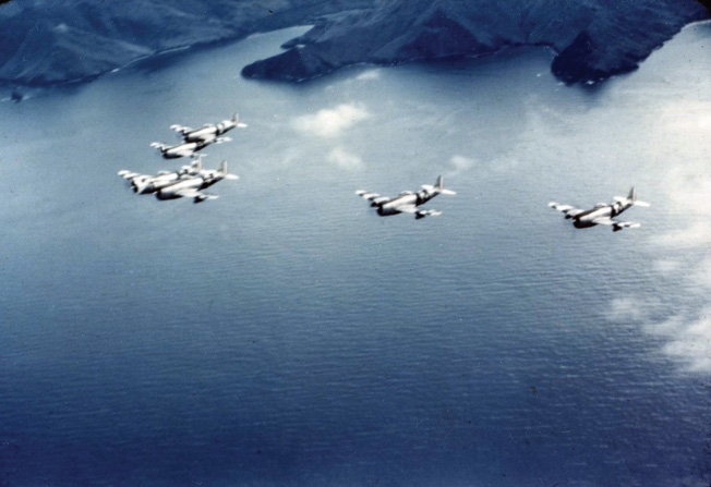 Flying above the island of Luzon in the Philippines, P-47 Thunderbolts of the Mexican 201st Fighter Squadron wing their way toward a Japanese target.