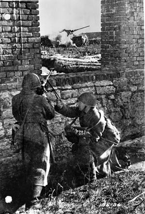 A pair of Red Army soldiers fires a PTRD-41 antitank rifle at a German tank somewhere on the Eastern Front in 1943. The Soviets employed the antitank rifle long after other weapons had been developed.