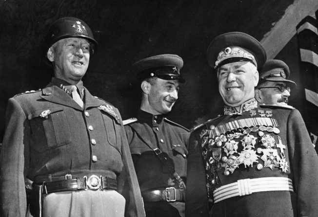 General George S. Patton, Jr. (left) strains to smile in company with Marshal Georgi Zhukov during a September 7, 1945, parade in Berlin. The two were present during activities celebrating the Allied victory over Japan.