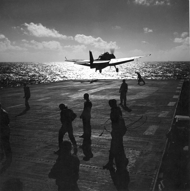 During a strike against Japanese defenses and air installations on Saipan, a Grumman TBF Avenger takes off from the deck of an American aircraft carrier on June 14, 1944. Primarily used as a torpedo bomber, the Avenger was a multipurpose aircraft that could also attack land targets with conventional bombs.