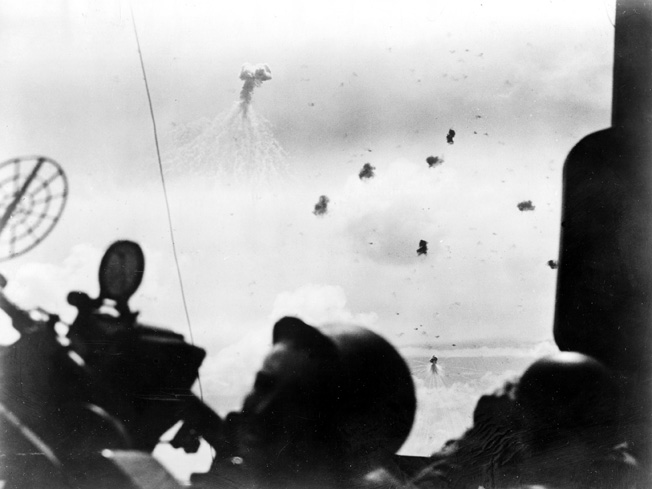 Taken by a U.S. Navy combat photographer aboard the cruiser USS Mobile, this image captures a Japanese dive-bomber attacking the aircraft carrier USS Wasp. Several U.S. carriers, including Wasp, were named for predecessors that had been sunk in action against the Japanese in 1942. Two years later during the Battle of the Philippine Sea, the U.S. Navy was the strongest in the world.