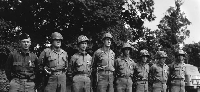 Ten Pointe du Hoc Rangers received the Distinguished Service Cross for gallantry during the seizure of the Pointe on D-Day. Eight of the recipients are pictured here, including Lieutenant Colonel James E. Rudder, commander of the 2nd Ranger Battalion, standing at far left.