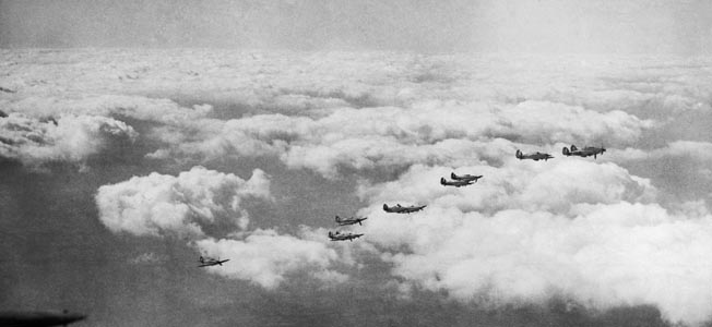 Hawker Hurricane fighters of Bader’s 242 Squadron are shown in formation above the coast of England. At the time Bader was shot down in 1941, he was the leading ace of the Royal Air Force in World War II. 