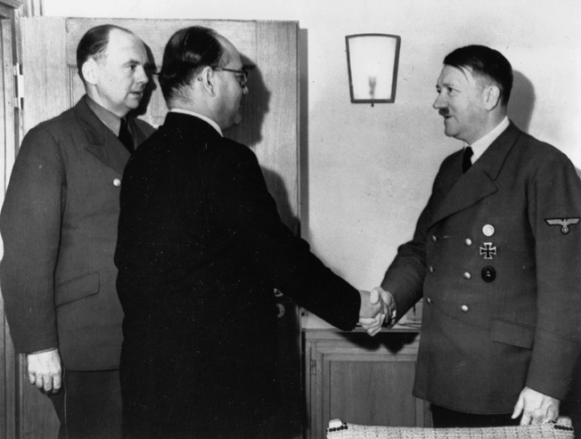 ADOLF HITLER (1889-1945). Chancellor of Germany, 1933-45. Hitler with Indian nationalist leader Subash Chandra Bose (shaking hands) and Dr. Paul Otto Schmidt in East Prussia, Germany. Photographed 1 June 1942.