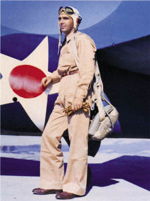 Butch O’Hare poses beside his F4F-3 Wildcat, spring 1943. He is wearing a leather cowboy belt instead of the standard-issue web belt.