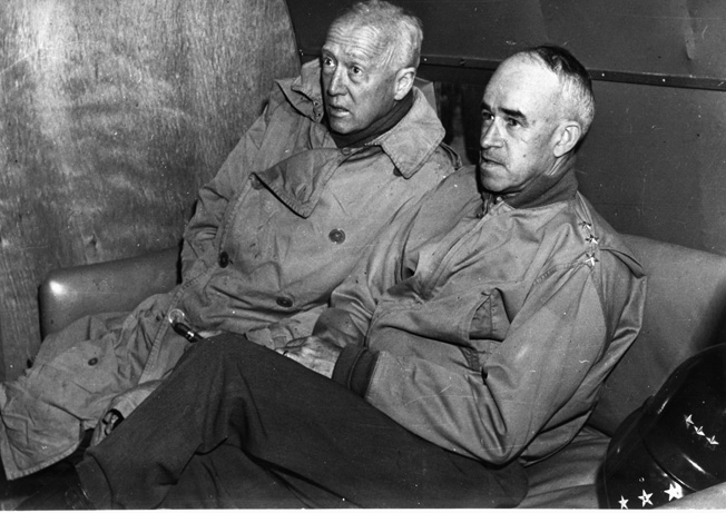 On an inspection flight along the Western Front on September 9, 1944, General George S. Patton, Jr. (left) and General Omar Bradley reveal their strain and fatigue during the campaign to liberate Western Europe from the Nazis.