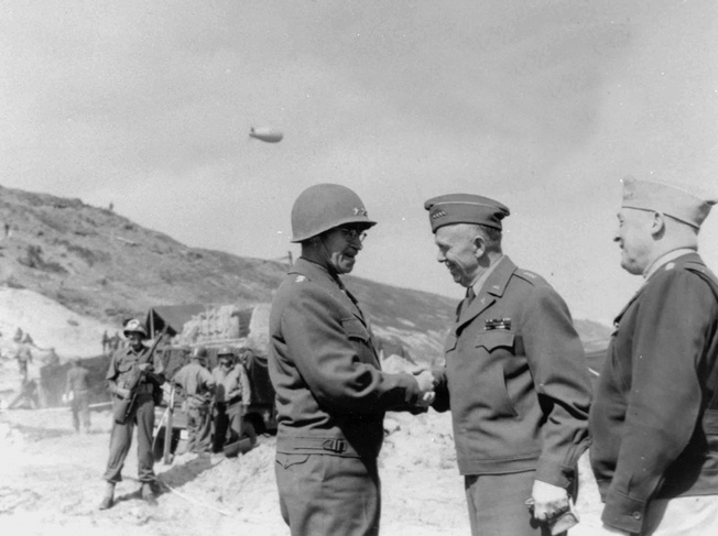 Marshall (right) greets General Omar Bradley, commander of the U.S. First Army in Normandy in June 1944. Bradley was later elevated to command of the Allied 12th Army Group.