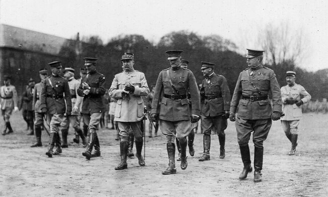 Following a ceremony on April 29, 1919, during which a number of French and American officers received decorations, Marshal Philippe Pétain of France and American General John J. Pershing walk from the assembly area near Metz.