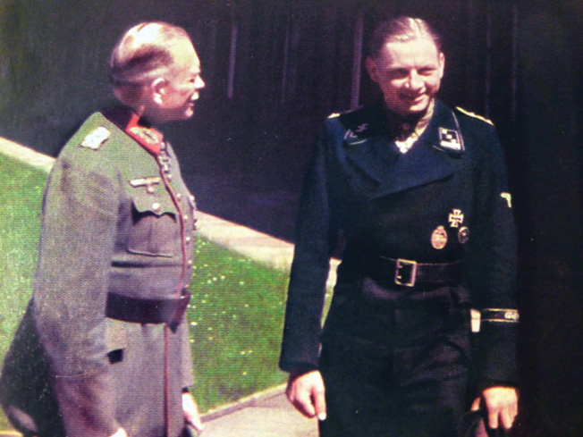 Tiger tank commander Michael Wittmann (right) wears the distinctive black uniform of the panzer corps. Wittmann is in conversation with General Heinz Guderian, the father of the Nazi Blitzkrieg tactics that overran Poland, much of Western Europe, and vast territory in Russia during the early days of World War II.