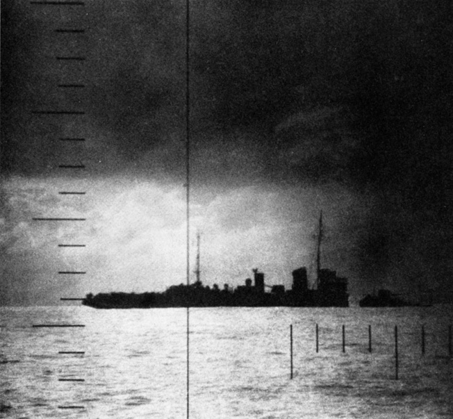 Shot through the periscope of an American submarine, this photograph records the final moments of a Japanese patrol craft torpedoed off the coast of Formosa.