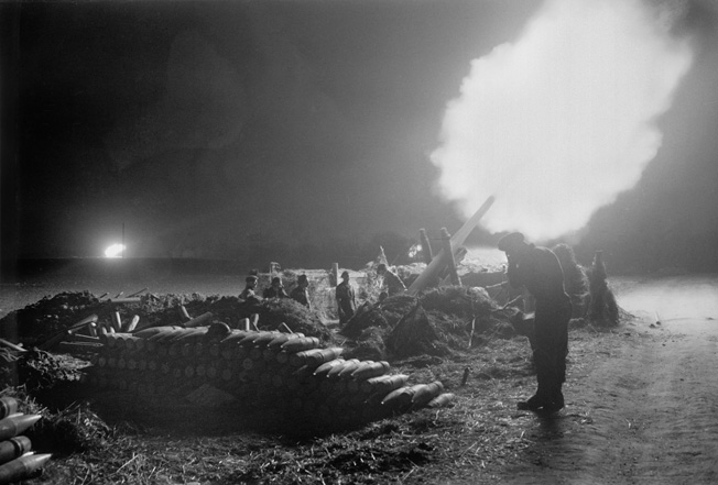 Heavy artillery supported the Allied 21st Army Group while crossing the Rhine during the predawn hours of March 24, 1945. In this photo, 5.5-inch guns fire on the Germans across the river during the bombardment that preceded the jumping off of units involved in Operation Plunder.