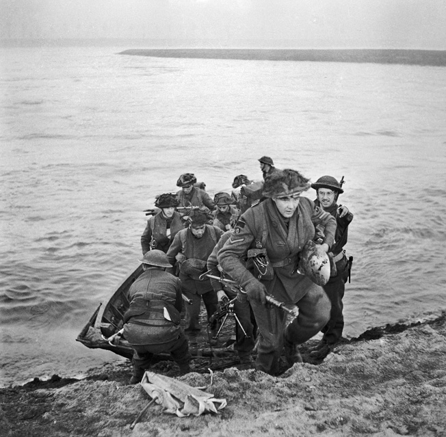 Exiting their flimsy storm boats, these soldiers of the 15th Scottish Division have just completed a successful crossing of the Rhine on the morning of March 24, 1945. The storm boats were less than popular with the troops, particularly in swift moving waterways.