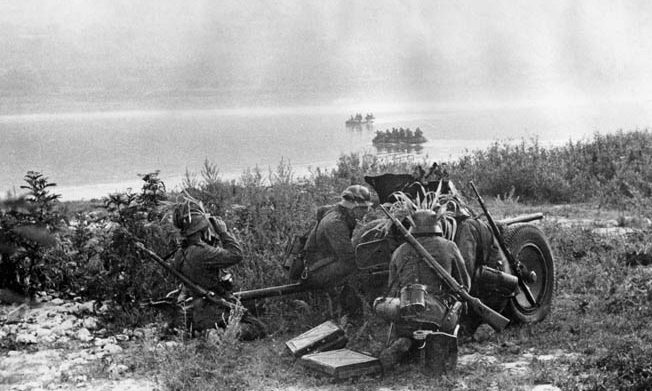 In preparation to support the crossing of a Russian stream during the advance on Rostov, the crew of a German antitank gun sets up a defensive position. 