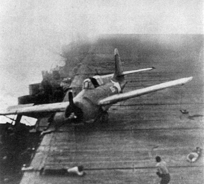 Making an emergency landing while the Enterprise is under attack by planes from the Japanese carrier Junyo, this Grumman F4F Wildcat skids across the flight deck.