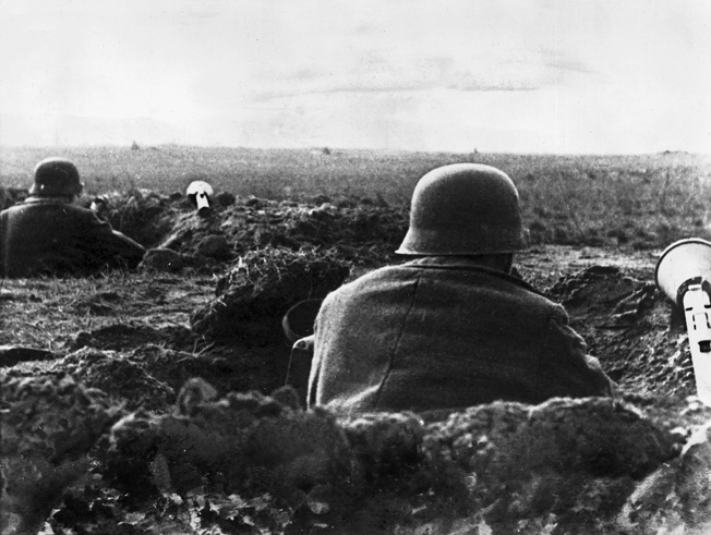 German soldiers with Panzerfaust anti-tank artillery in foxholes near the Seelow Heights.