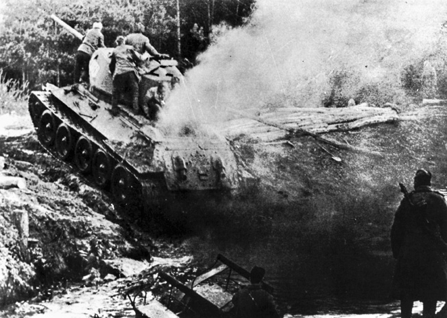 A T-34 Soviet tank crossing the Oder River during the Battle of the Seelow Heights, 18 or 19 April 1945.